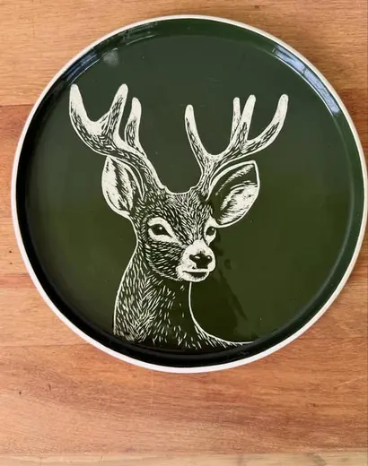 Hand-carved stag platter in forest green by Sara Thomson Ceramics