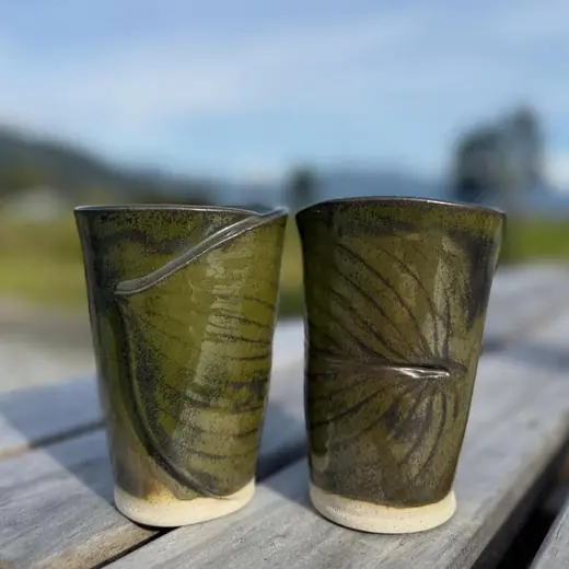 Olive green tumblers with pressed leaf impressions
